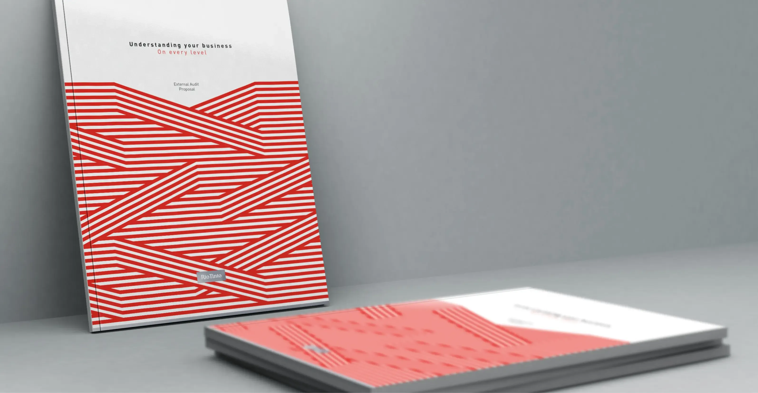 Rio Tinto booklets designed by PitchX with a matching red and white striped pattern across cover and pages